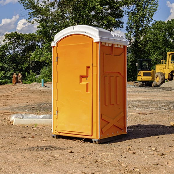 what is the cost difference between standard and deluxe portable restroom rentals in Distant